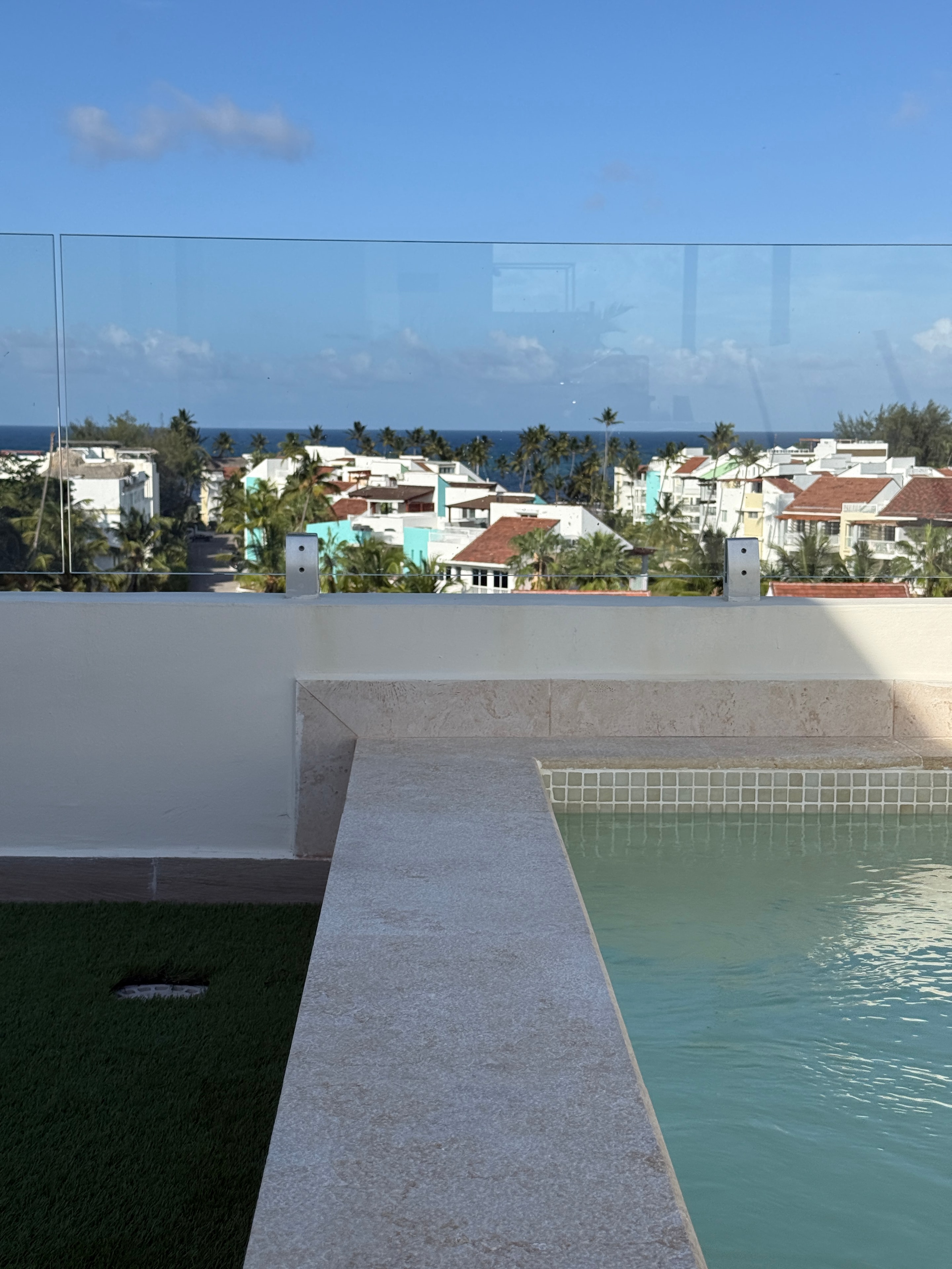 AlaNiqueStay rooftop pool with sweeping views of the tropical Caribbean coastline in Punta Cana